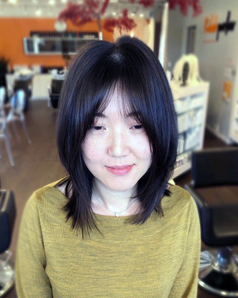 Asian Woman With Modified Mid Length Shag Bangs Brave Cute Hairstyle