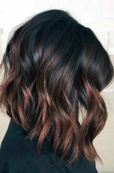 A Wine Colored Womens Balayage With Glamorous Dark Red Undertones