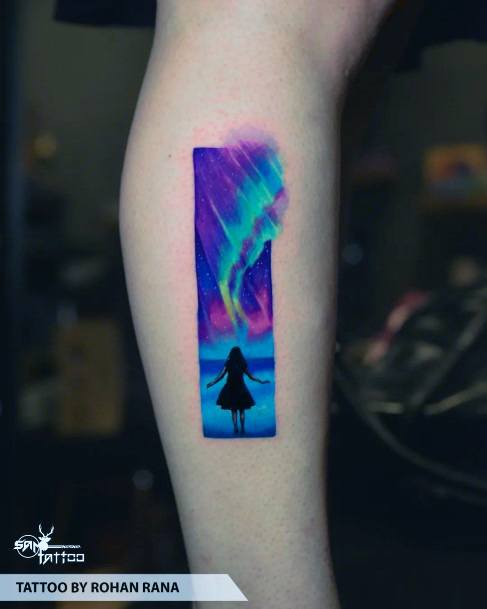 Surrealist Northern Light tattoo on the upper arm
