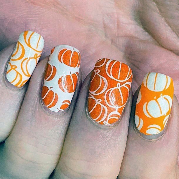 Alternating White And Orange Pumpkin Nails For Women