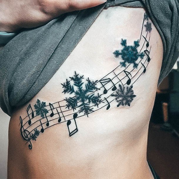 Amazing Music Tattoo Ideas For Women Rib Cage Side With Snowflakes