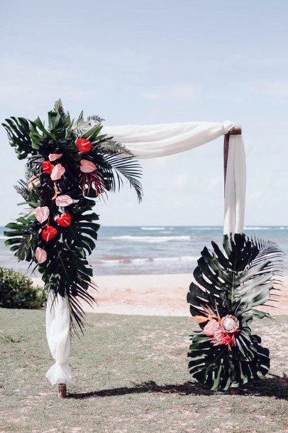 Angled Arch Wedding Decor With Tropical Flowers