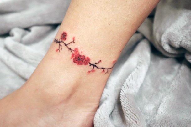 Cherry blossom ankle wrap by Donghwa Tattoos Ale  Butterblume  Ale  ankle   Cherry blossom a  Cherry tattoos Blossom tattoo Tattoos  for women flowers