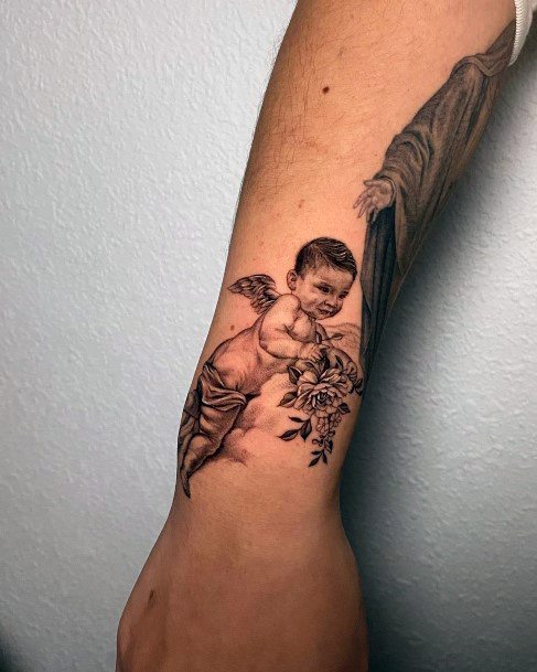 baby angel tattoo sleeve