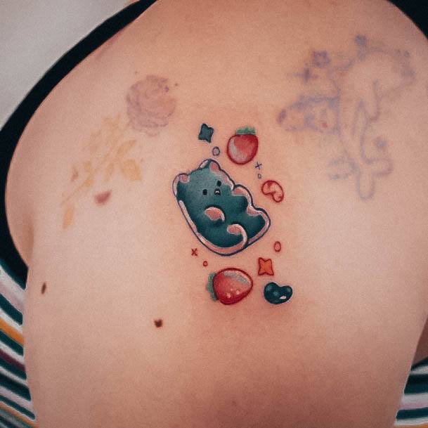 Appealing Womens Gummy Bear Tattoos With Fruits On Shoulder