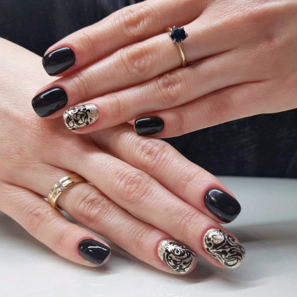 Arabic Pattern Black And Gold Nails