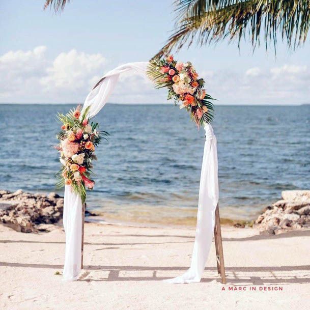 Arched White Curtains And Beach Wedding Decor