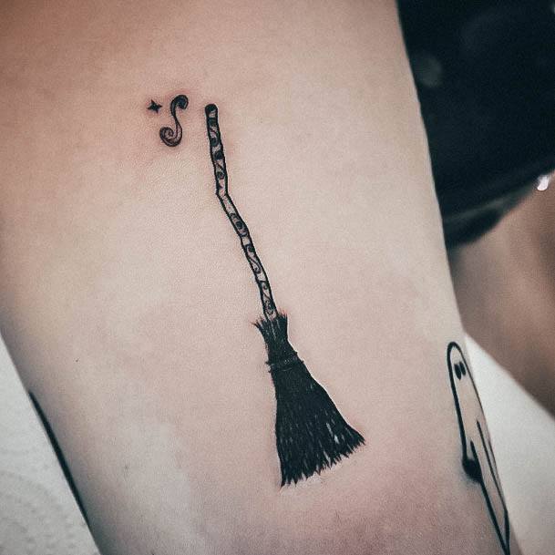 Artistic Broom Tattoo On Woman