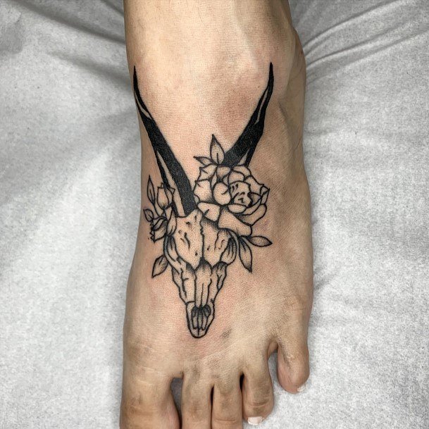 Artistic Capricorn Tattoo On Woman Skull Foot