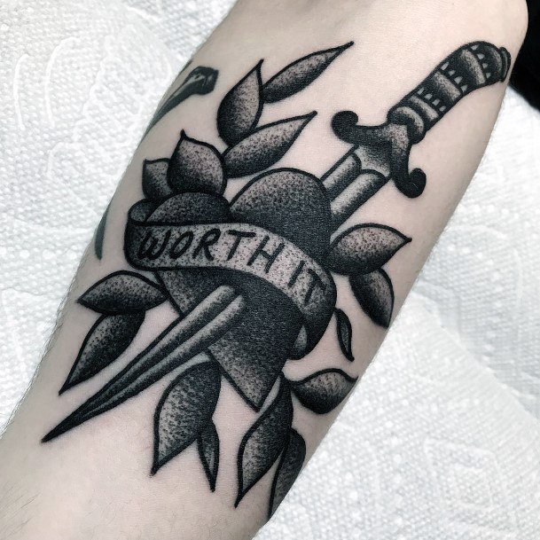 Artistic Dagger Heart Tattoo On Woman