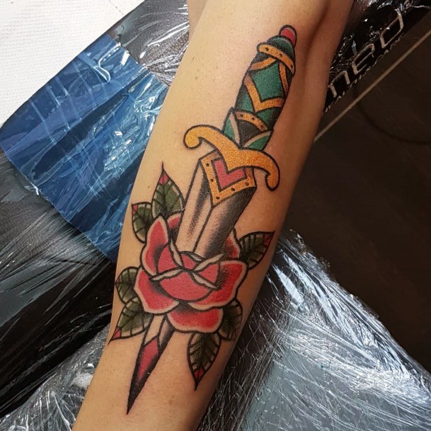 Artistic Dagger Rose Tattoo On Woman