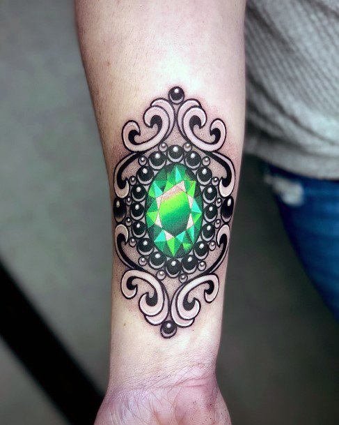 Artistic Emerald Tattoo On Woman