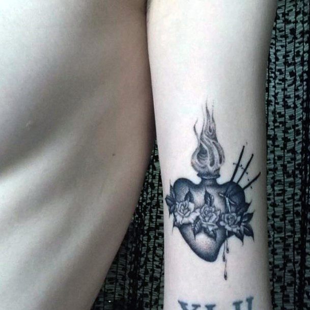 Artistic Flaming Heart Tattoo On Woman