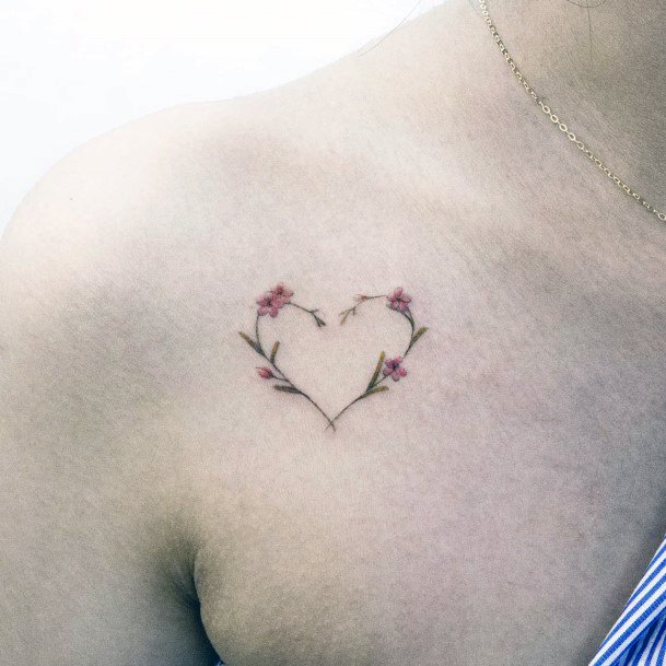 Artistic Flower Heart Tattoo On Woman