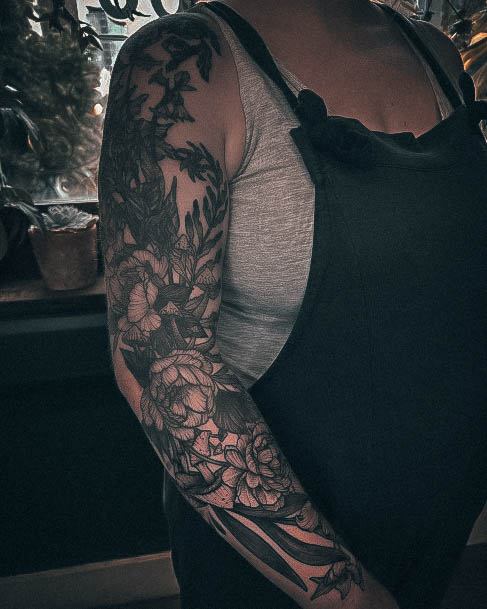 Artistic Full Sleeve Tattoo On Woman