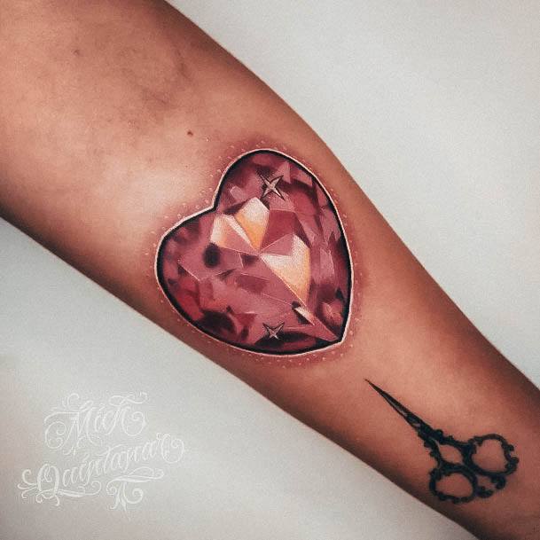 Artistic Gem Tattoo On Woman Heart Red Jewel