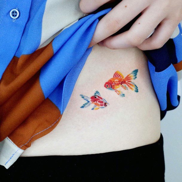 Artistic Goldfish Tattoo On Woman