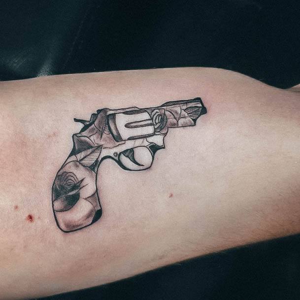 Artistic Gun Tattoo On Woman Rose Flower Themed