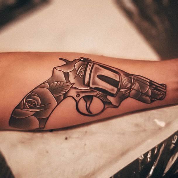 Artistic Gun Tattoo On Woman