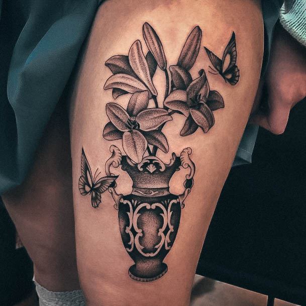 Artistic Lily Tattoo On Woman Thigh Vase Design