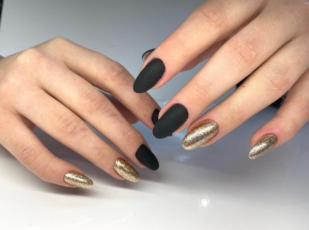 Artistic Matte Black And Gold Nail On Woman