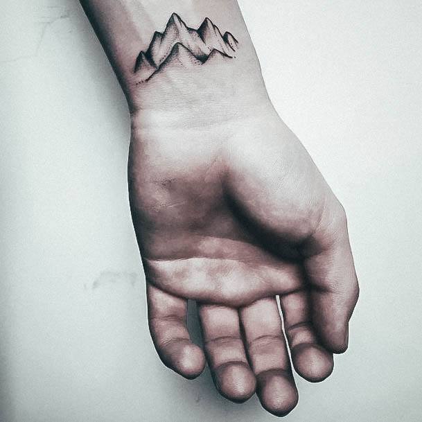 Artistic Mountain Tattoo On Woman Wrist