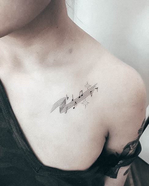 Artistic Music Note Tattoo On Woman