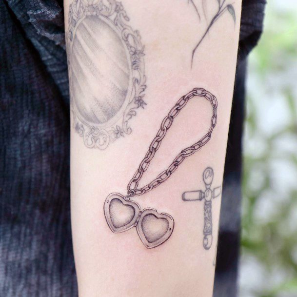 Artistic Pendant Tattoo On Woman