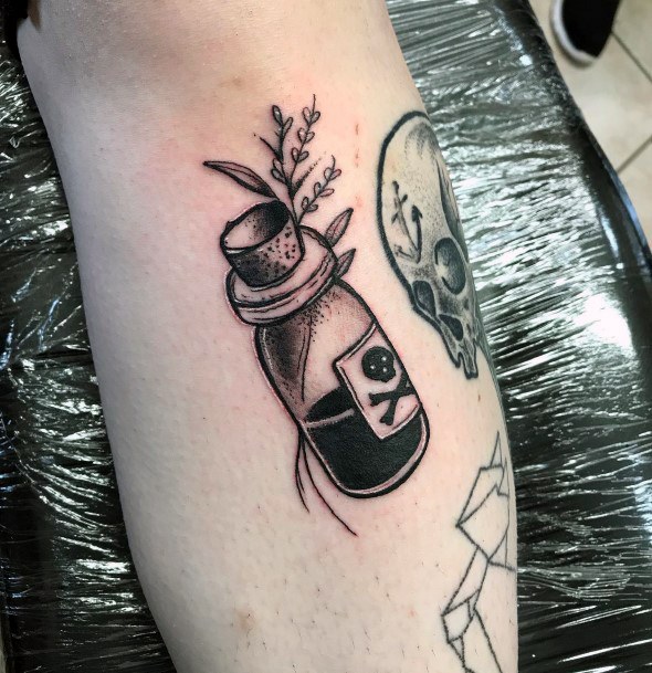 Artistic Poison Bottle Tattoo On Woman