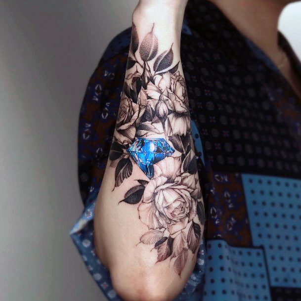 Artistic Sapphire Tattoo On Woman