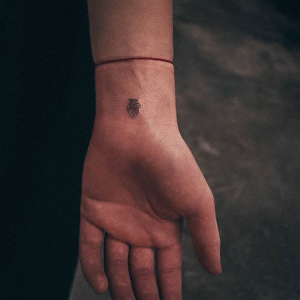 Artistic Small Heart Tattoo On Woman