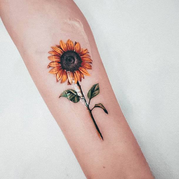 Artistic Small Sunflower Tattoo On Woman