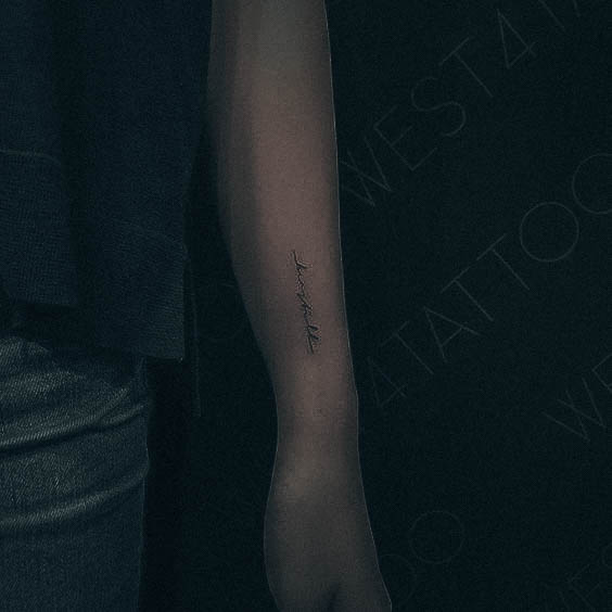 Artistic Small Wrist Tattoo On Woman