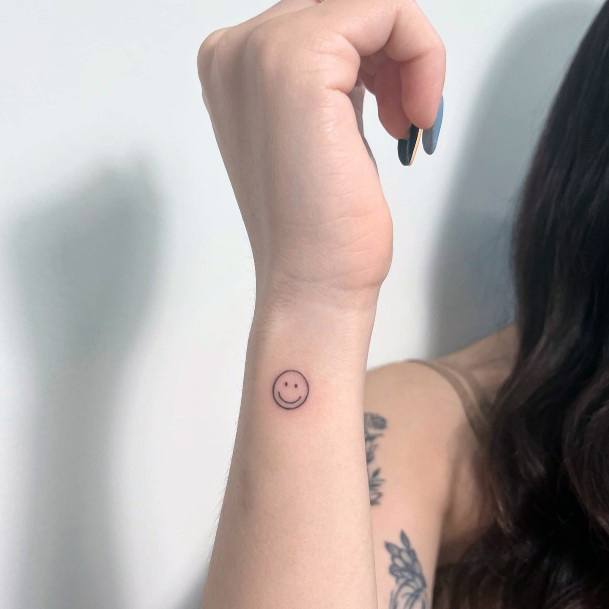 Artistic Smiley Face Tattoo On Woman
