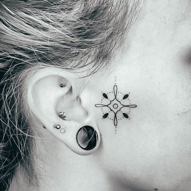 Artistic Snowflake Tattoo On Woman