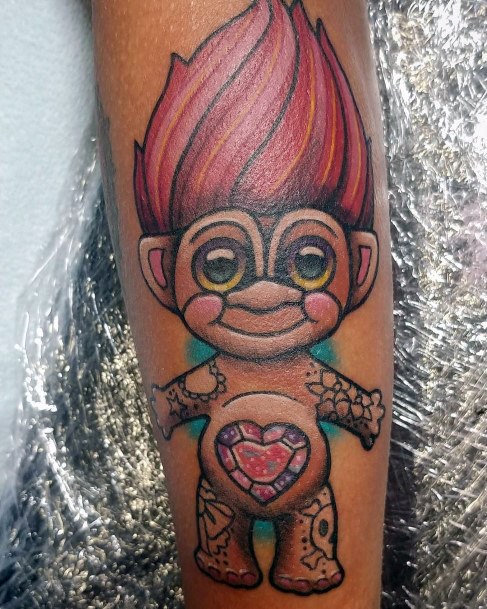 Artistic Troll Doll Tattoo On Woman