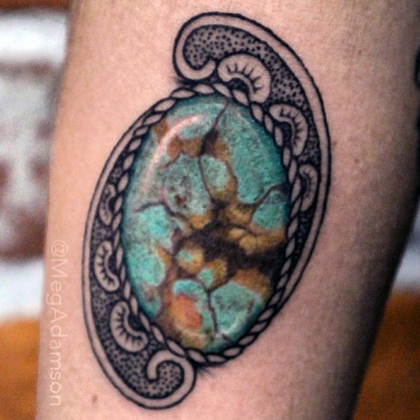 Artistic Turquoise Tattoo On Woman