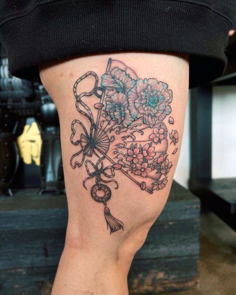 Artistic Uchiwa Tattoo On Woman