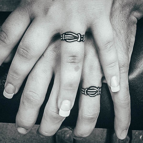 Artistic Wedding Ring Tattoo On Woman Finger Knot Rope