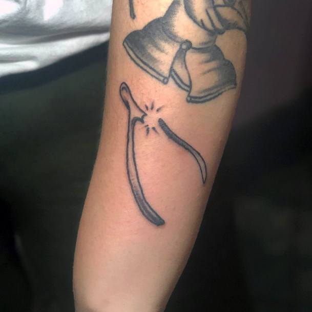 Artistic Wishbone Tattoo On Woman