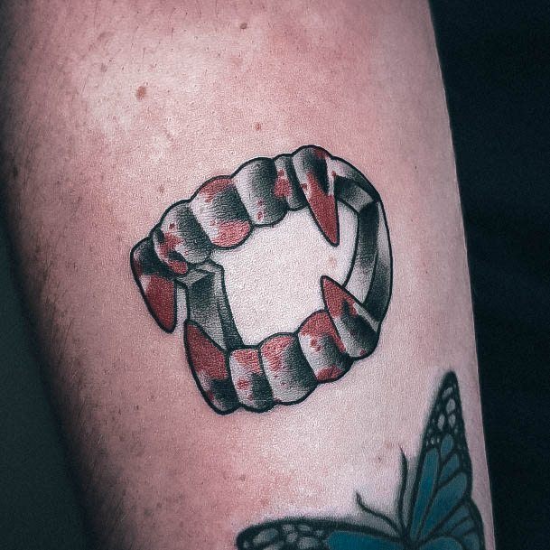 Astonishing Fangs Tattoo For Girls