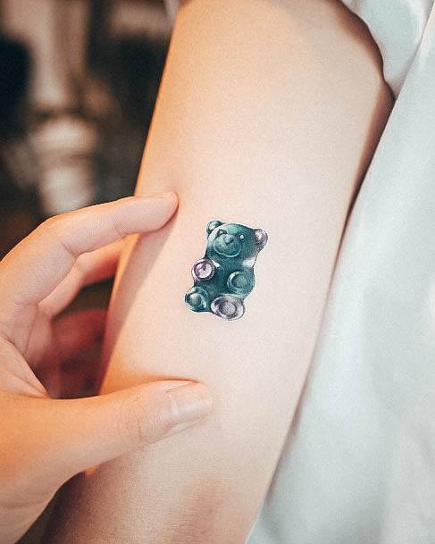 Minimalistic gummy bear tattoo done on the wrist