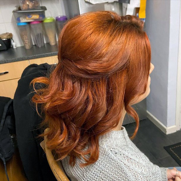 Auburn Haired Female With Shoulder Length Hair And Half Tie Back