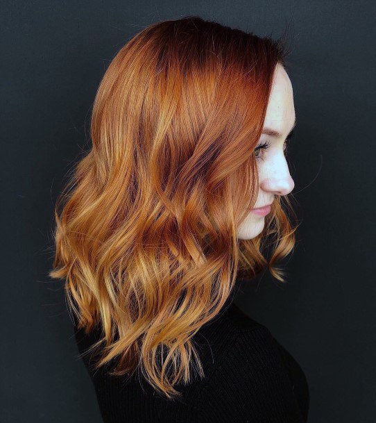 Auburn Medium Length Autumn Hair On Female With Side Part