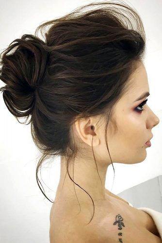 Autumn Female With Updo Of Softly Pulled Back Middle Of The Head Bun