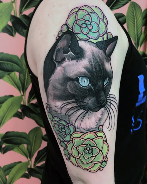 Azure Blue Eye Cat And Green Rose Tattoo For Women On Arms