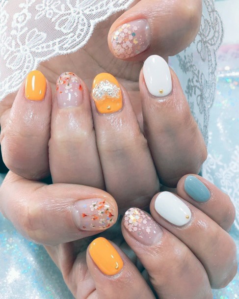 Baby Flower Designs On Colored Nails