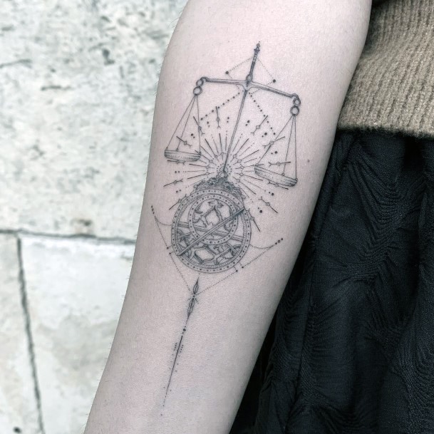 Balance Scale Themed Tattoo On Forearm