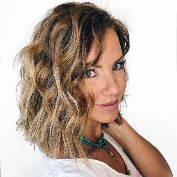 Beachy Textured Brown And Blonde Highlighted Shoulder Length Womens Hairstyle