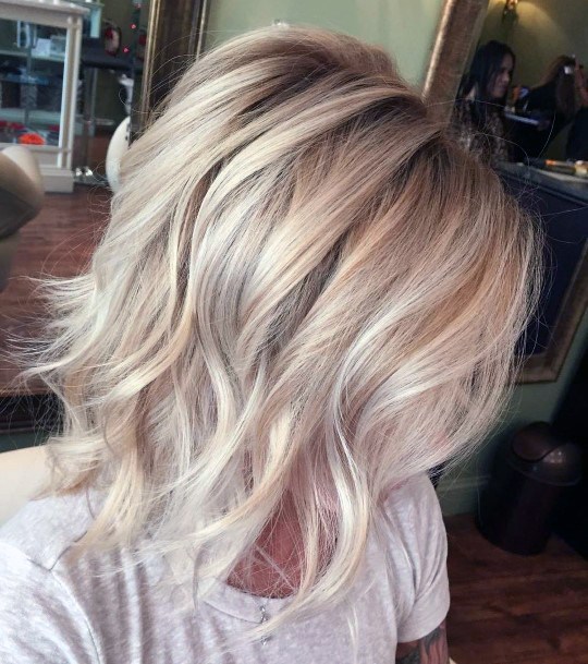 Beautiful Beachy Blonde Highlighted Bouncy Curls Women’s Hairstyle Inspiration Idea